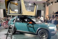 Rivian’s new ‘treehouse’ rooftop tent comes with a movie projector